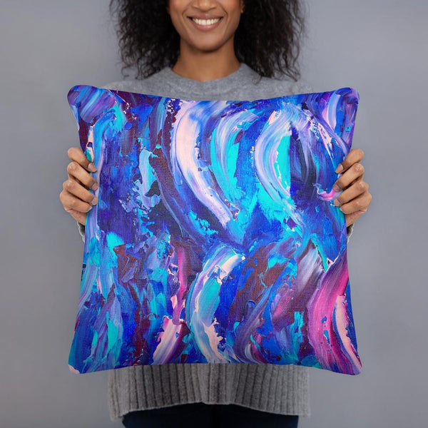 Decorative throw pillow with blue, purple and pink ribbons