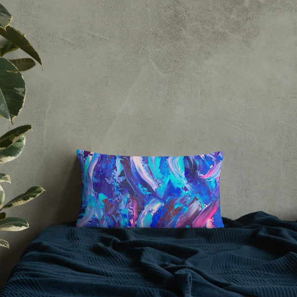 Decorative throw pillow with blue, purple and pink ribbons