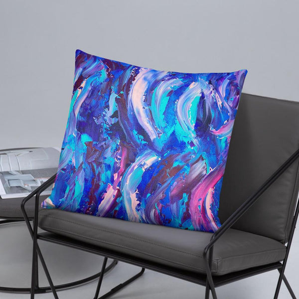 Decorative throw pillow with blue, purple and pink ribbons