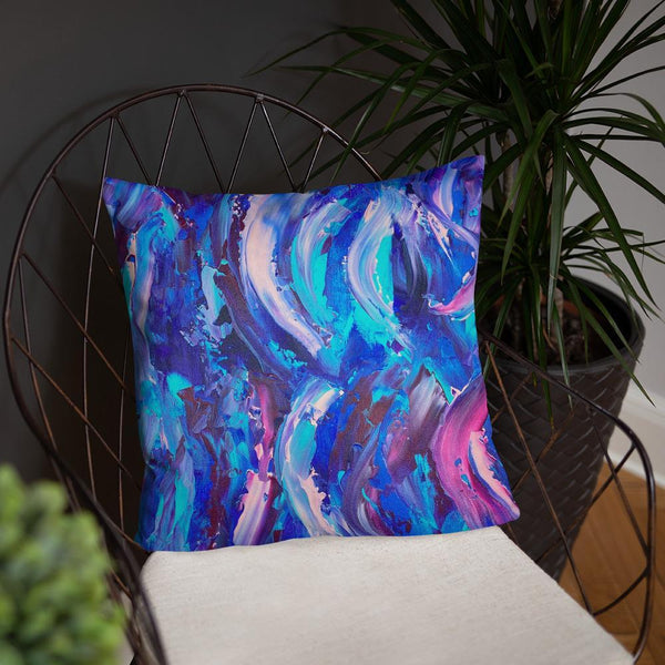 Decorative throw pillow with blue, purple and pink ribbons