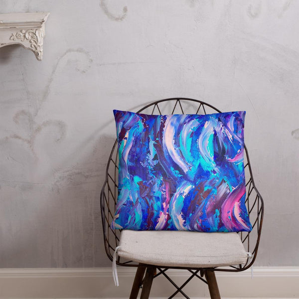 Decorative throw pillow with blue, purple and pink ribbons
