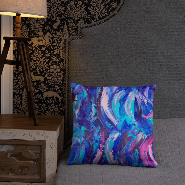 Decorative throw pillow with blue, purple and pink ribbons