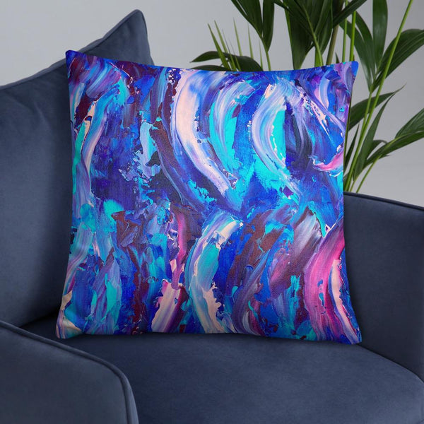 Decorative throw pillow with blue, purple and pink ribbons