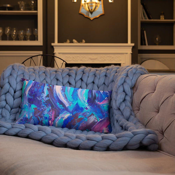 Decorative throw pillow with blue, purple and pink ribbons