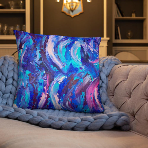 Decorative throw pillow with blue, purple and pink ribbons