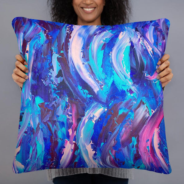 Decorative throw pillow with blue, purple and pink ribbons