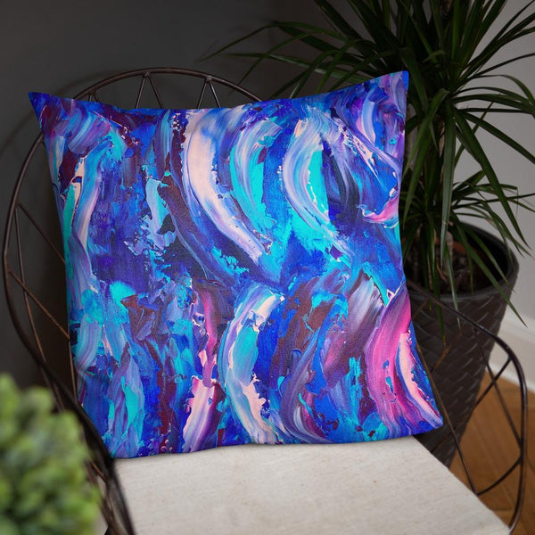 Decorative throw pillow with blue, purple and pink ribbons