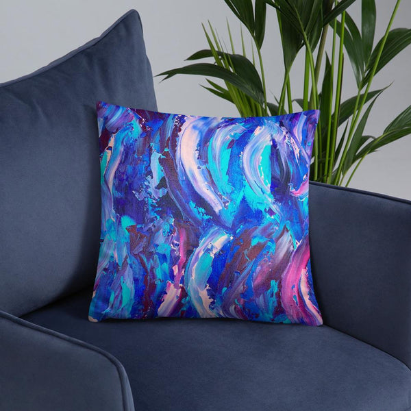 Decorative throw pillow with blue, purple and pink ribbons