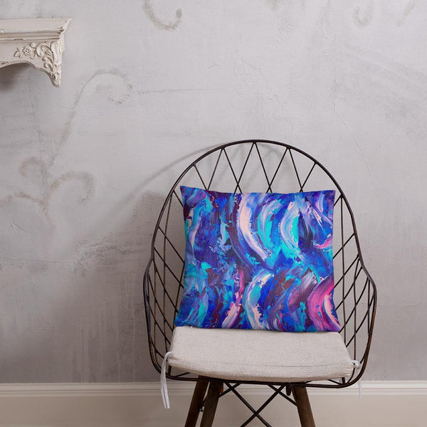 Decorative throw pillow with blue, purple and pink ribbons