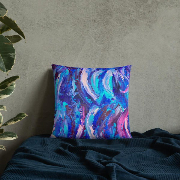 Decorative throw pillow with blue, purple and pink ribbons