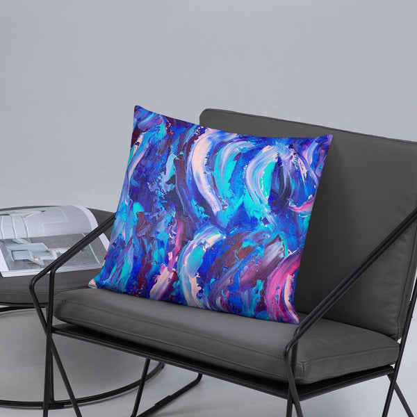 Decorative throw pillow with blue, purple and pink ribbons