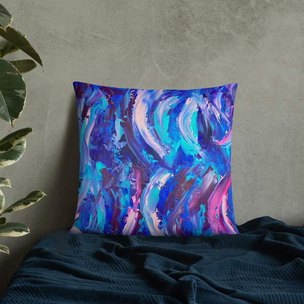Decorative throw pillow with blue, purple and pink ribbons