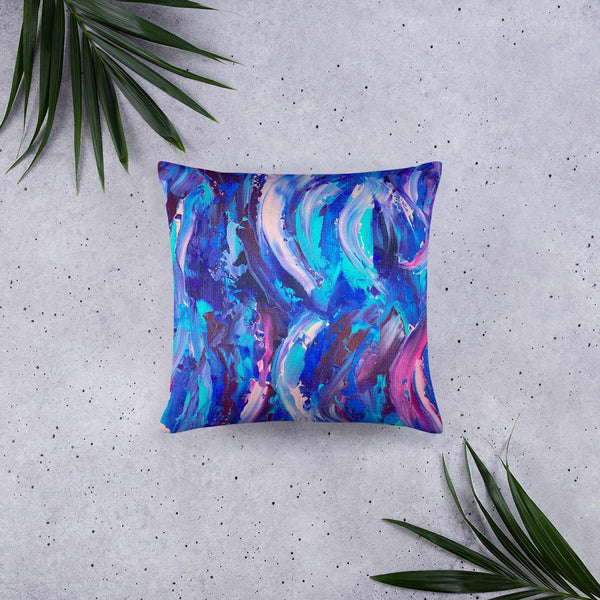 Decorative throw pillow with blue, purple and pink ribbons