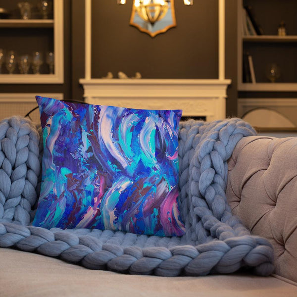 Decorative throw pillow with blue, purple and pink ribbons
