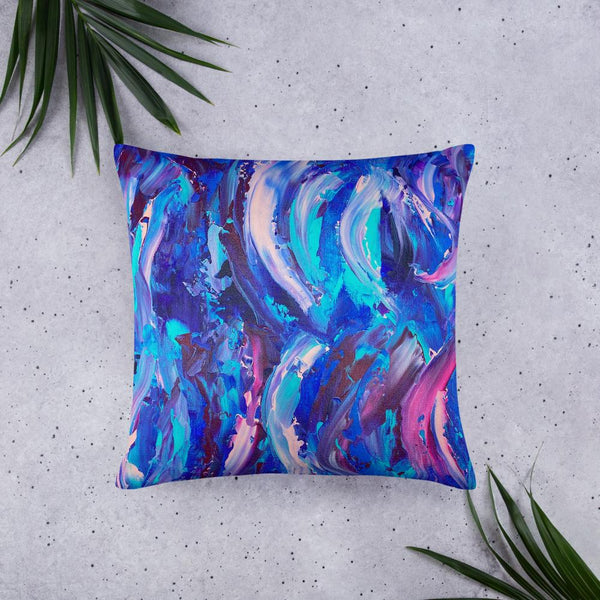 Decorative throw pillow with blue, purple and pink ribbons