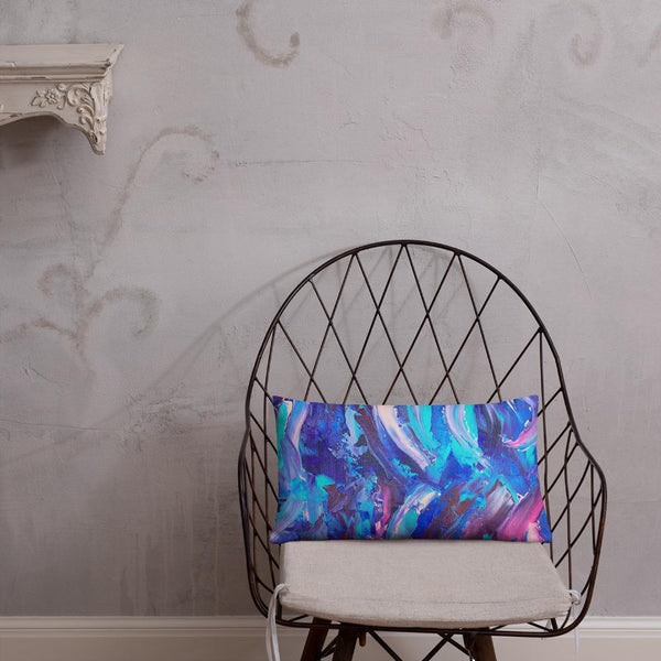 Decorative throw pillow with blue, purple and pink ribbons