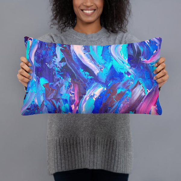 Decorative throw pillow with blue, purple and pink ribbons