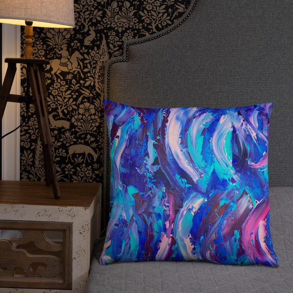 Decorative throw pillow with blue, purple and pink ribbons