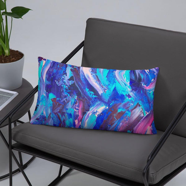 Decorative throw pillow with blue, purple and pink ribbons